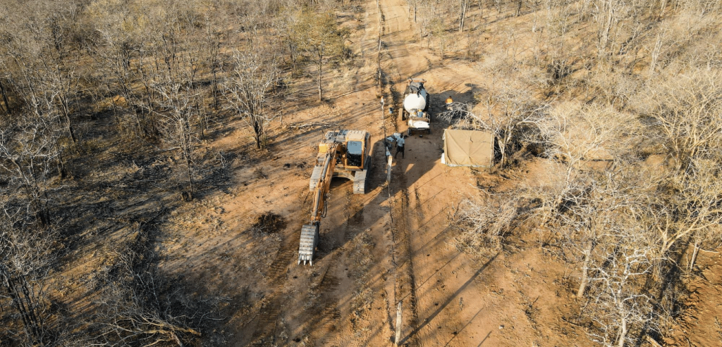 Excavator digging elephant trench 